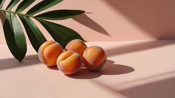Apricot fruit with palm leaves shadow on a pastel pink background. Summer aesthetic concept. photo