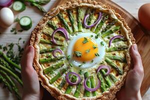 Delicious Asparagus, Red Onion, and Egg Quiche on Rustic Wooden Table photo