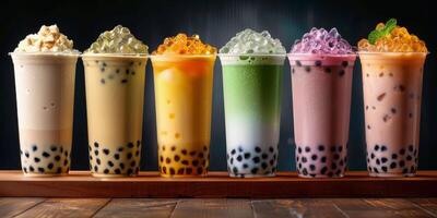 Colorful Bubble Tea Drinks With Tapioca Pearls and Ice in Plastic Cups photo