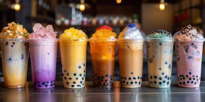 Colorful Bubble Tea Drinks With Tapioca Pearls and Ice in Plastic Cups photo