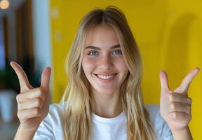 Young Blonde Woman With Red Striped Shirt Pointing Right With Shocked Expression photo