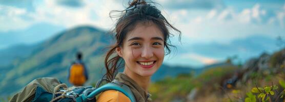 Smiling Woman Hiking Through Mountainous Landscape photo