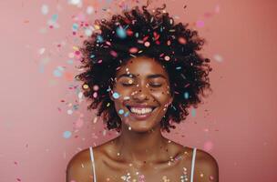 Woman With Short Curly Hair Smiling in Confetti photo