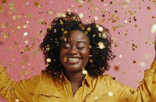 Happy Woman Celebrating With Confetti in Front of Pink Background photo