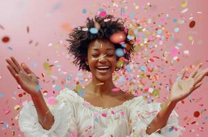 Happy Woman Celebrating With Confetti in Studio photo
