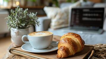Freshly Baked Croissant and Cappuccino on a Sunny Morning Table photo