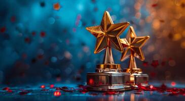 Two Gold Star Trophies on Blue Background With Red Confetti photo