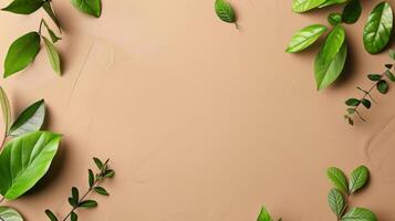 A close-up shot of green leaves scattered on a tan background photo