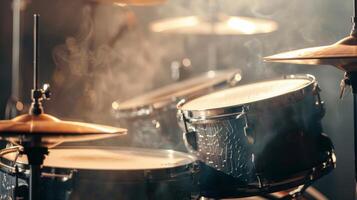 Close-up of a drum set with smoke and light photo