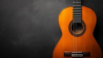 A close-up shot of a classical guitar against a dark background photo