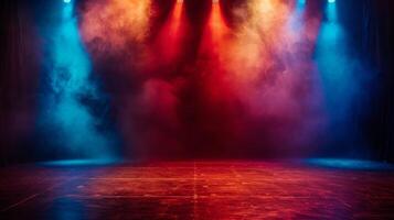 A stage lit by red and blue spotlight beams in a smoky setting photo