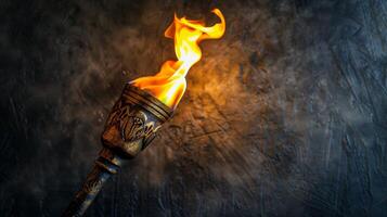 A close-up shot of a burning torch against a textured background photo