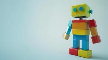 Colorful wooden robot toy with a bright blue background photo
