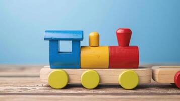 A close-up of a colorful wooden toy train on a wooden table photo