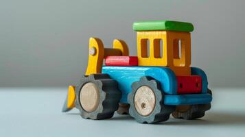 Closeup of a colorful wooden bulldozer toy photo