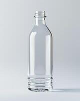 A clear plastic bottle with a ribbed base on a white background photo
