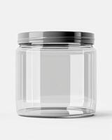 A clear glass jar with a black lid, isolated on a white background photo