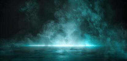 Teal fog rolls in over a calm ocean at dusk photo