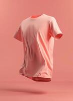 A pink t-shirt mockup with a soft, natural drape against a peach background photo