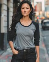 A model showcasing a blank raglan shirt with gray sleeves and black sleeves photo