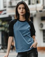 Woman wearing a blue raglan tee with black sleeves photo