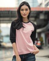Woman in a pink raglan shirt with black sleeves photo