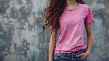 A model wears a plain pink shirt with room for your text photo