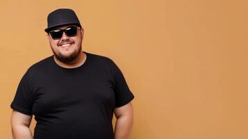 A man in a black shirt smiles for the camera photo