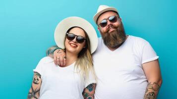 A happy couple wearing white t-shirts and sunglasses smiles for the camera photo