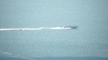 Speed Boat Ships wake. Aerial drone shot over the boat. Foam trail with waves. High speed white yacht from above. Ocean Waves, Aerial Drone Shot Over Speed Boat video