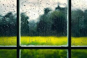 A window glass frame with raindrops on it representing the season of monsoon photo