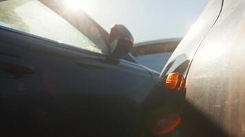 Close-up shot of a blinking emergency turn signal light, following an accident on a sunny day. Close up. Slow motion video