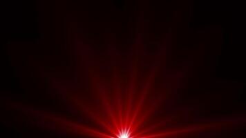 Red color optical flares or futuristic light rays shining on black background video