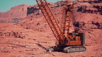 A large crane sitting in the middle of a desert video