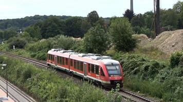 View of moving and stationary trains on railway tracks at a station in northern Germany. video