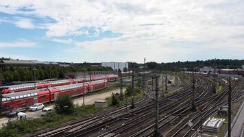 View of moving and stationary trains on railway tracks at a station in northern Germany. video