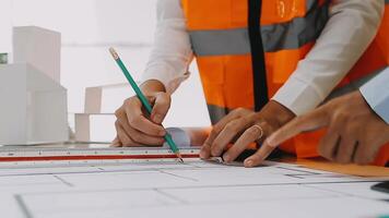 Construction and structure concept of engineer working drawing on blueprint meeting for project working with partner on model building and engineering tools in working site, construction concept video