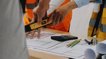 Construction and structure concept of engineer working drawing on blueprint meeting for project working with partner on model building and engineering tools in working site, construction concept video