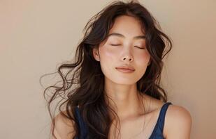 Woman With Long Brown Hair Posing With Eyes Closed photo