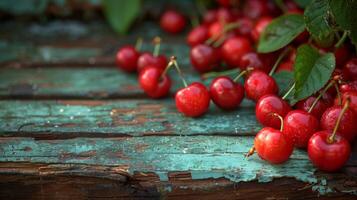 Ripe Red Cherries on Rustic Weathered Wooden Table photo