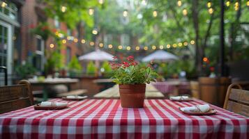 Outdoor Restaurant Patio With Red And White Checkered Tablecloths And String Lights photo