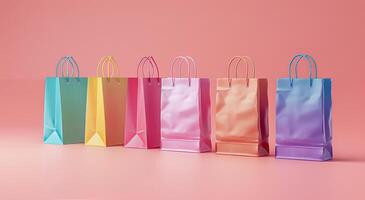 Colorful Paper Shopping Bags Arranged In A Row On A Pink Background photo