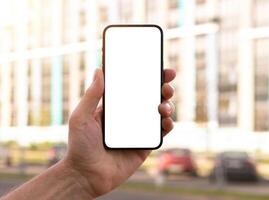 Mobile phone held in a hand. Perfect for digital and technology themes. Clean and modern design, on photo