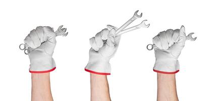 Close up of a hand holding a spanner. Handy repair tool set for fixing. Isolated on white background photo