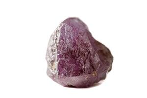 macro mineral stone alexandrite red - violet in daylight on a white photo
