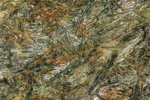 Macro stone mineral Diopside Calcite Magnetite on a white background photo