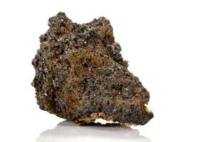 Macro of a mineral stone Vesuvianite on a white background photo