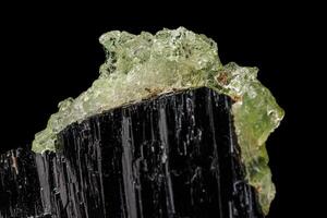 Macro stone Hyalite mineral, tourmaline Sherl, smoky quartz on a black background photo