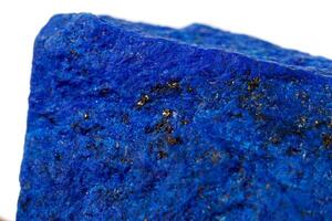 Macro Azurite mineral stone with Pyrite inserts on a white background photo