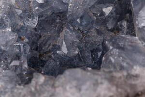 Celestine mineral stone macro on microcline on black background photo